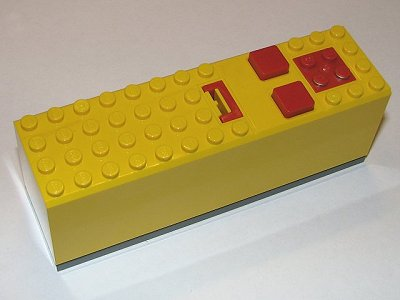 2847c03 | Electric 9V Battery Box 4 x 14 x 4 with Red Buttons and Contact Plate with Dark Bluish Gray Base | LEGOPART